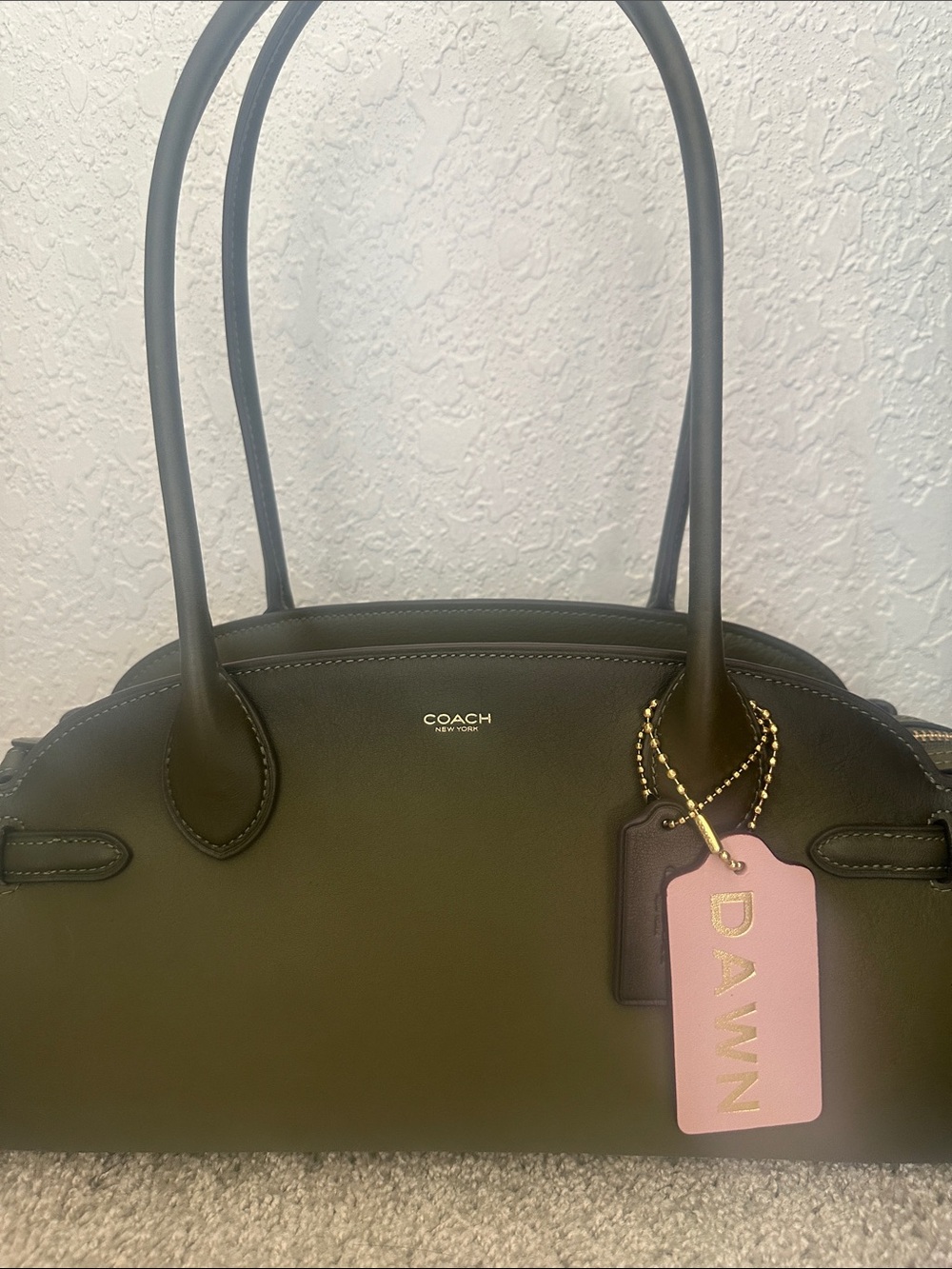 Coach Empire 34 in the beautiful olive green with a slight burnishing. EUC!